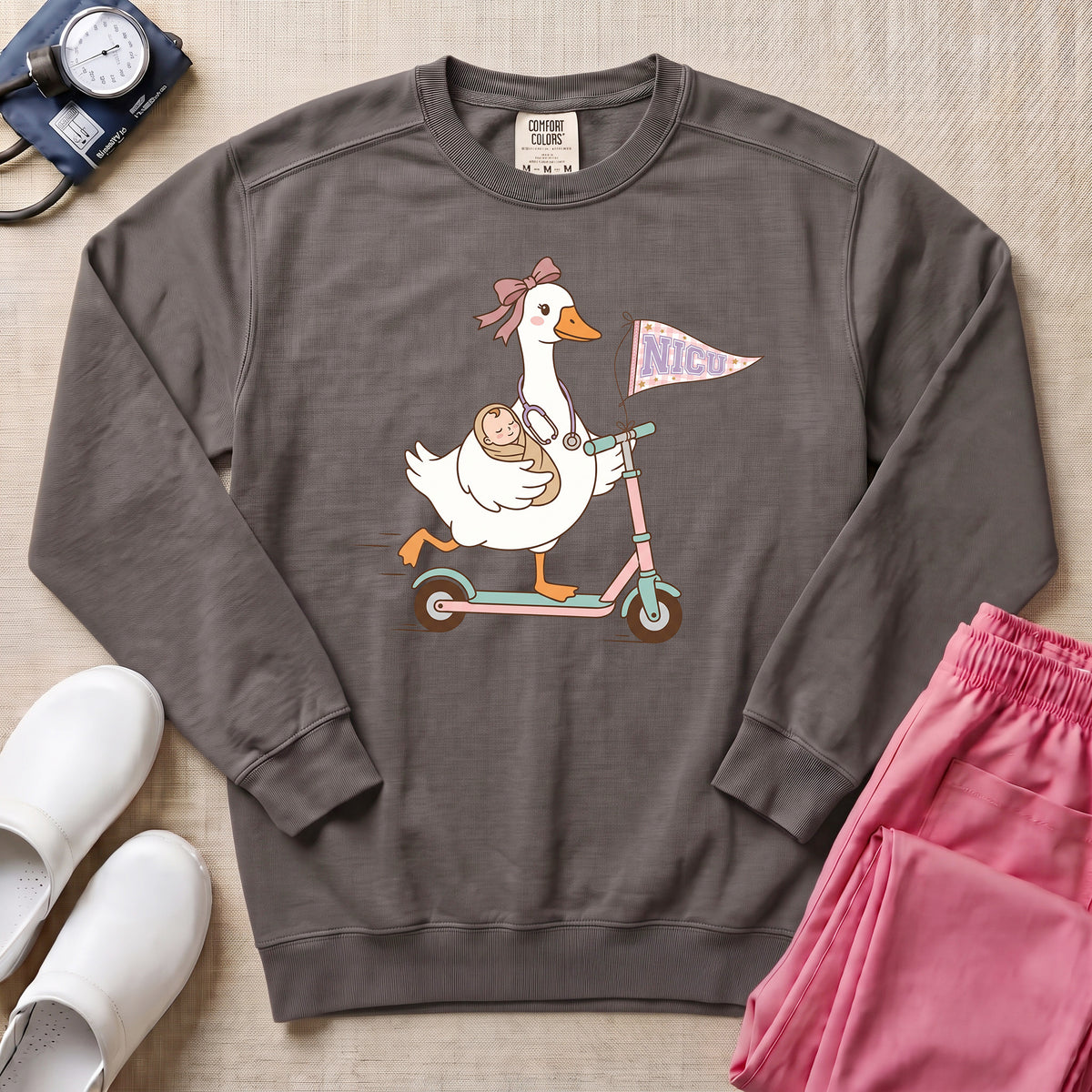 Coquette Goose Riding Scooter NICU Nurse Sweatshirt - Pepper Lifestyle Hero Mockup | HugTee