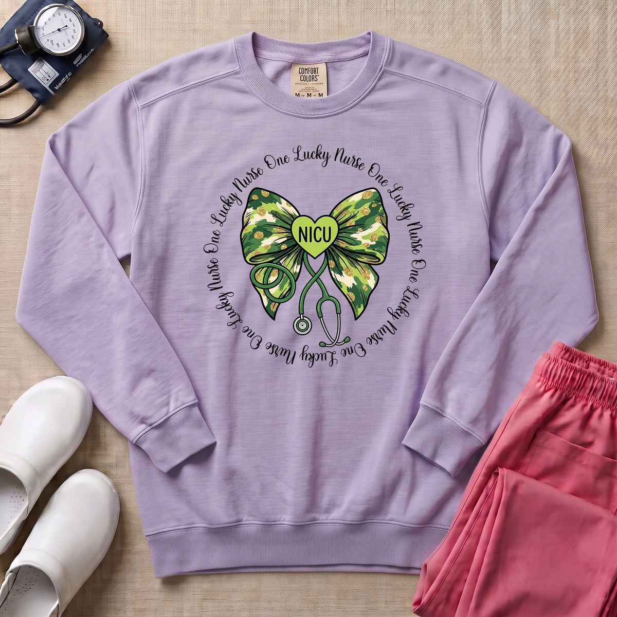 One Lucky Nurse Camo Bow NICU Sweatshirt - Orchid Comfort Colors Sweatshirt | HugTee