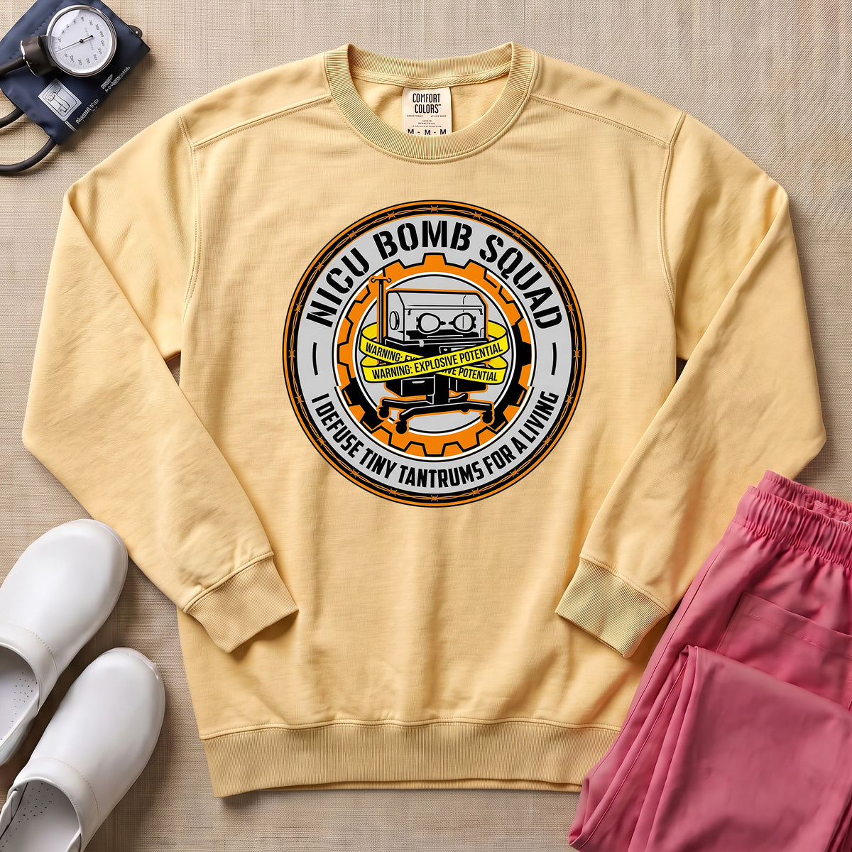 Funny NICU Bomb Squad Nurse Sweatshirt - Butter Comfort Colors Sweatshirt | HugTee