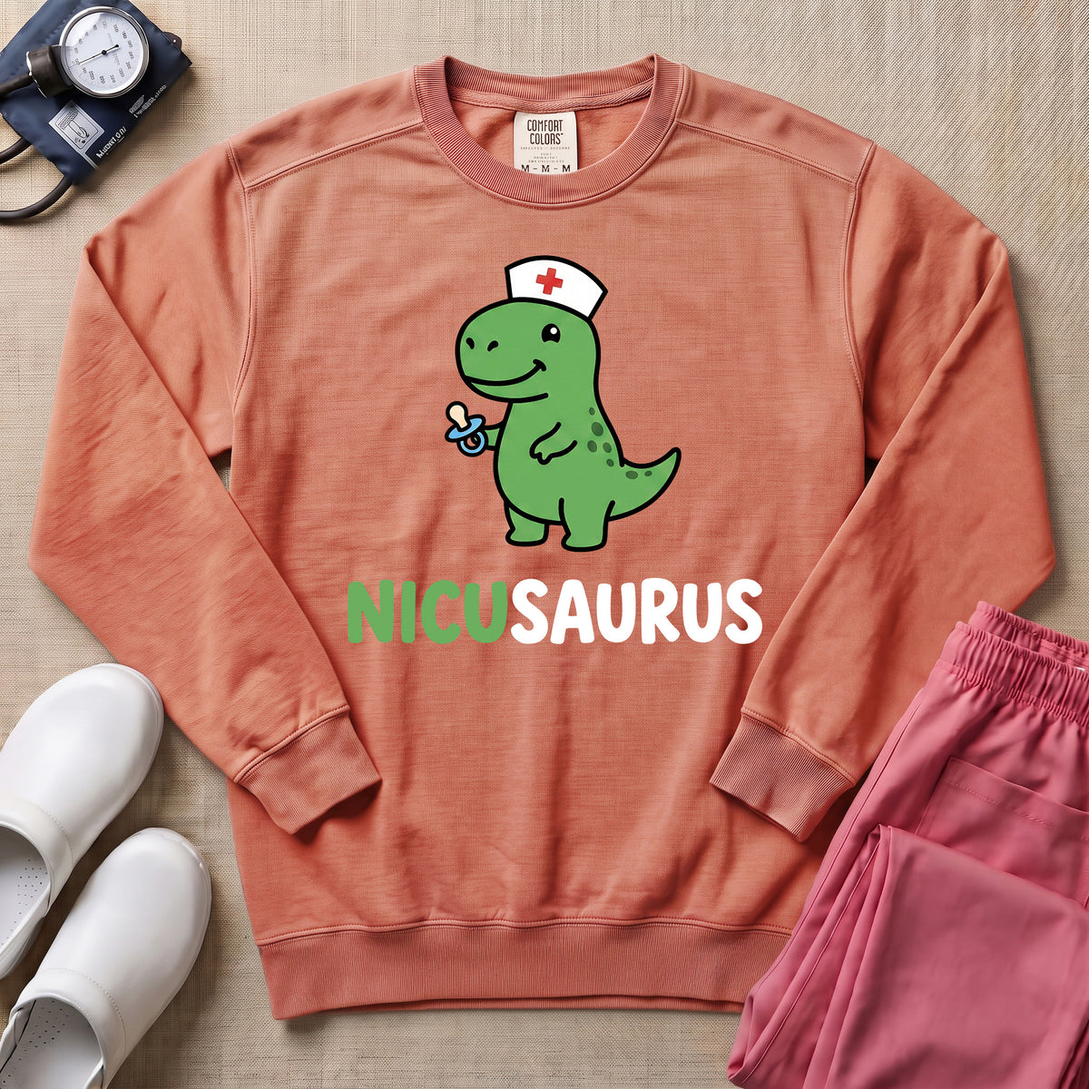 Funny NICUSAURUS Dinosaur Nurse Cute NICU Sweatshirt - Terracotta Comfort Colors Sweatshirt | HugTee