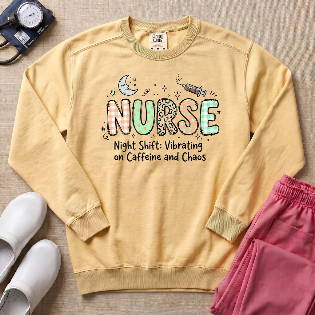 Nurse Night Shift Vibrating on Caffeine and Chaos Sweatshirt - Butter Comfort Colors Sweatshirt | HugTee