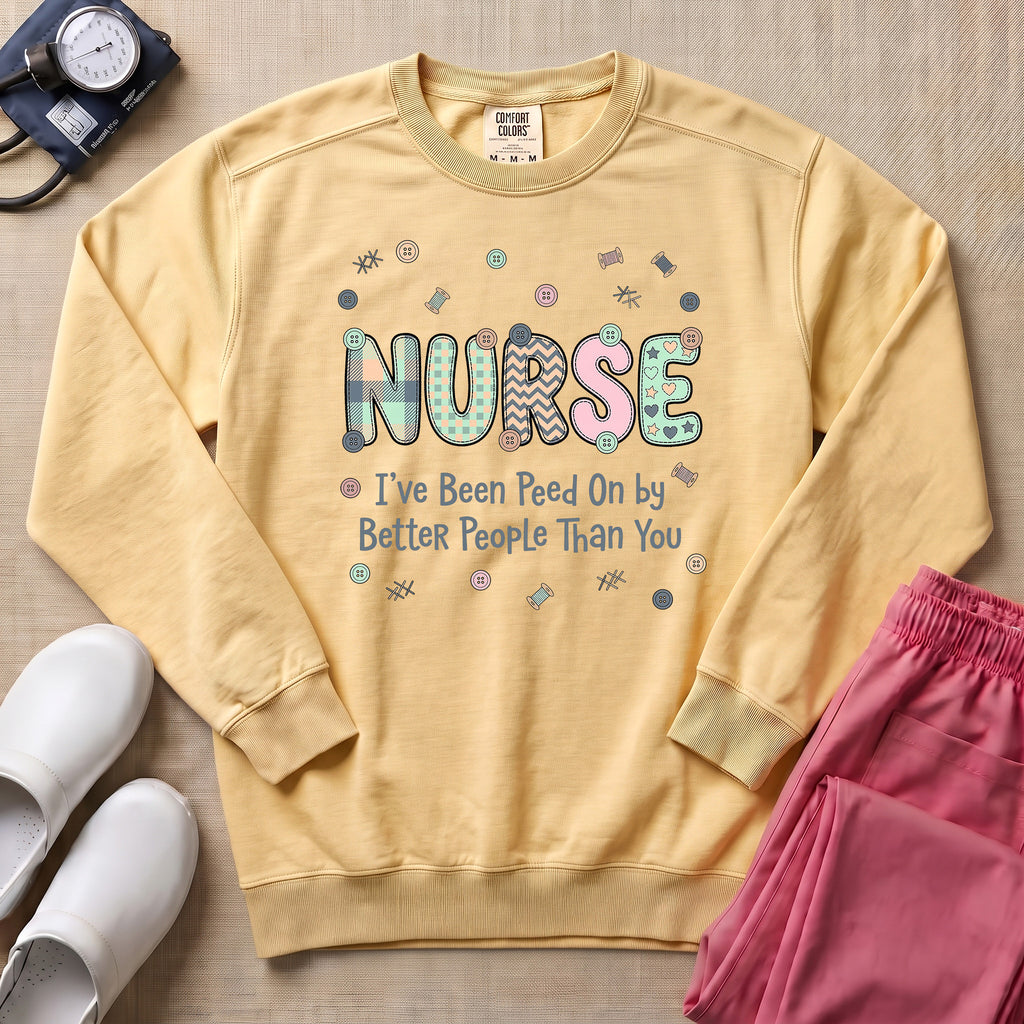 Funny Nurse I've Been Peed On By Better People Than You Sweatshirt - Butter Comfort Colors Sweatshirt | HugTee