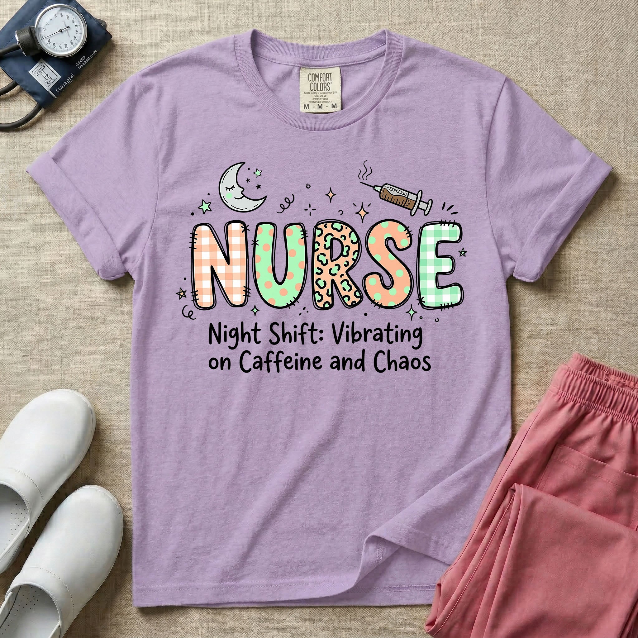 A humorous General Nursing graphic featuring the word NURSE in large, playfully patterned letters including plaid, leopard print, and floral designs, accented by a sleeping crescent moon and a syringe, positioned above text that reads Night Shift: Vibrating on Caffeine and Chaos.