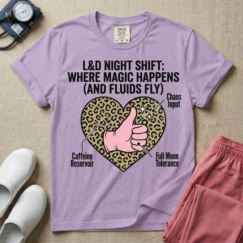 Labor and Delivery L&D nursing t-shirt featuring a leopard print heart diagram with a gloved thumbs-up and the text "L&D NIGHT SHIFT: WHERE MAGIC HAPPENS (AND FLUIDS FLY)"