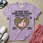 Labor and Delivery L&D nursing t-shirt featuring a leopard print heart diagram with a gloved thumbs-up and the text "L&D NIGHT SHIFT: WHERE MAGIC HAPPENS (AND FLUIDS FLY)"