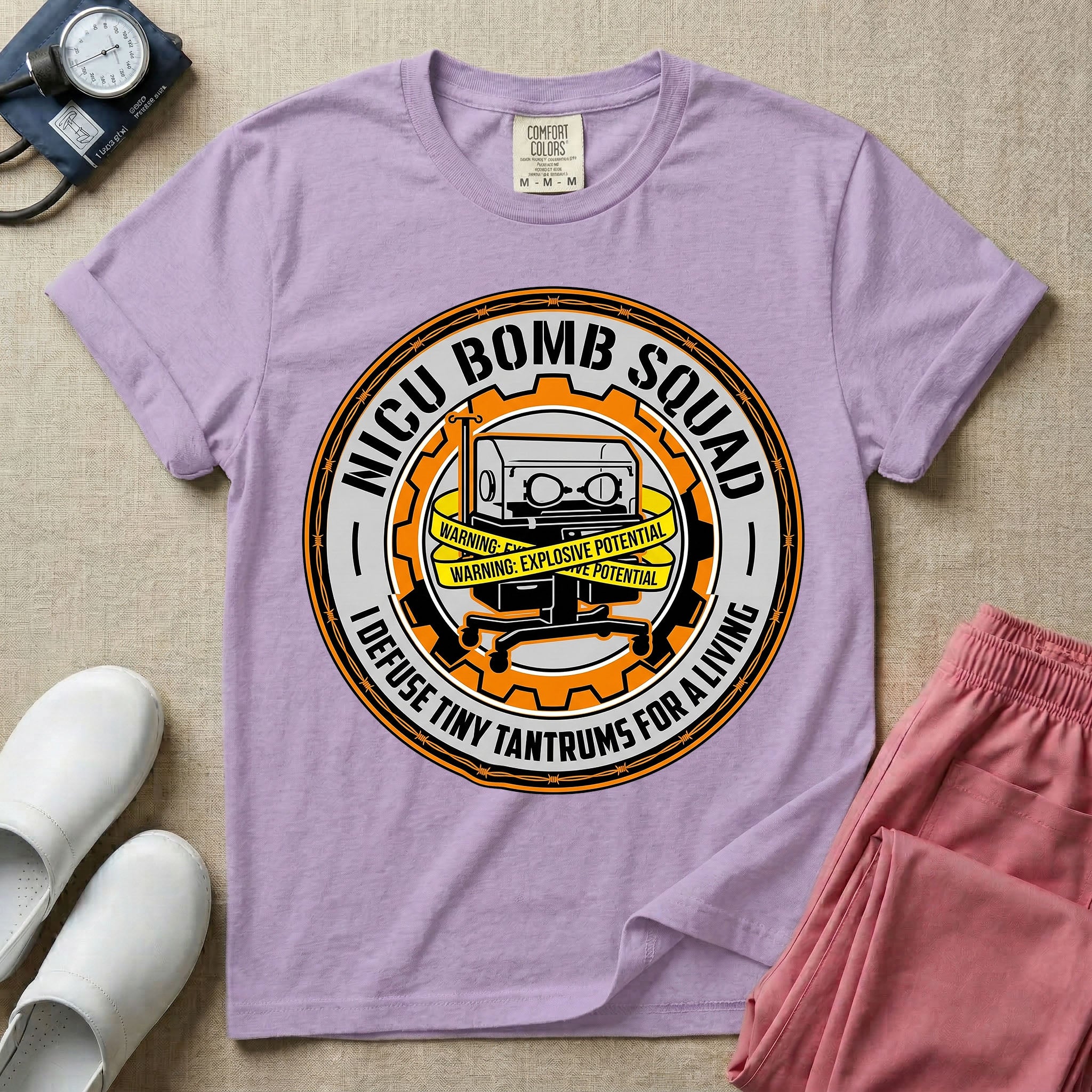 Neonatal Intensive Care Unit NICU nurse t-shirt with funny bomb squad defusing tiny tantrums graphic in orchid color.