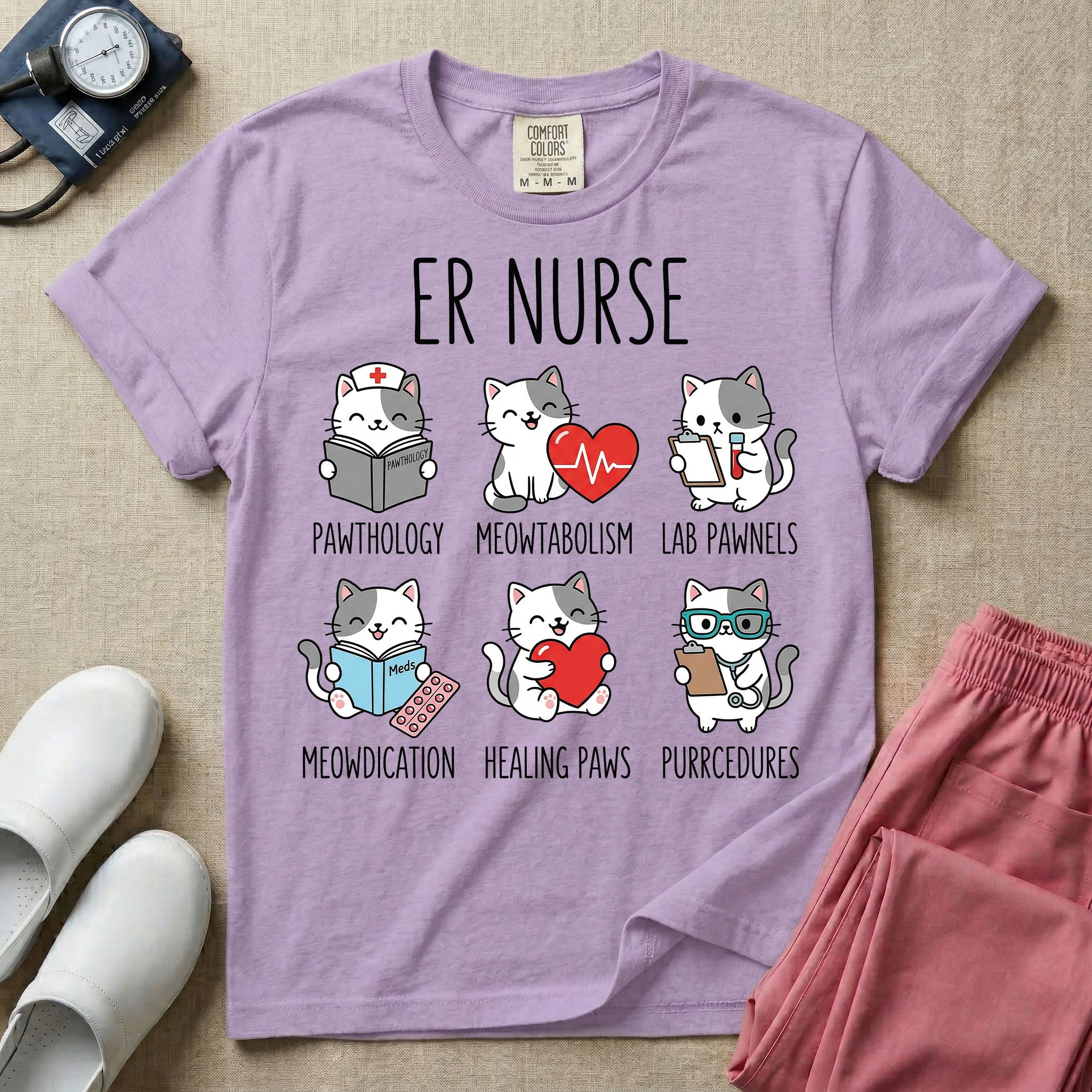 A funny t-shirt for emergency room nurses featuring the text "ER NURSE" above a grid of six cute cartoon cats demonstrating medical puns, including a cat reading for "PAWTHOLOGY", a cat with an ECG heart for "MEOWTABOLISM", a cat holding a test tube for "LAB PAWNELS", a cat with pills for "MEOWDICATION", a cat holding a heart for "HEALING PAWS", and a cat with a stethoscope for "PURRCEDURES".