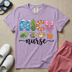 A cute t-shirt for NICU nurses featuring the text "NICU nurse" where the letters are designed with ocean elements like waves, seaweed, and a jellyfish, surrounded by under the sea creatures including a sea turtle, tropical fish, pufferfish, and starfish.