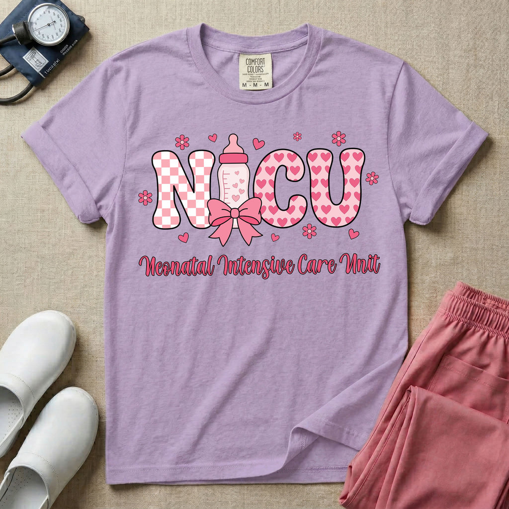 Retro coquette style t-shirt graphic featuring decorative pink 'NICU' text with checkerboard and heart patterns, incorporating a baby bottle with a bow and hearts, and the cursive text 'Neonatal Intensive Care Unit' below.