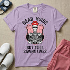 General nursing nurse t-shirt with a funny skeleton dead inside but still saving lives graphic in orchid color.