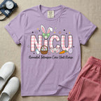 Neonatal Intensive Care Unit NICU nursing t-shirt featuring the letters NICU in a pink plaid pattern with bunny ears on the I, alongside a basket and Easter eggs, positioned above the cursive text "Neonatal Intensive Care Unit Nurse".