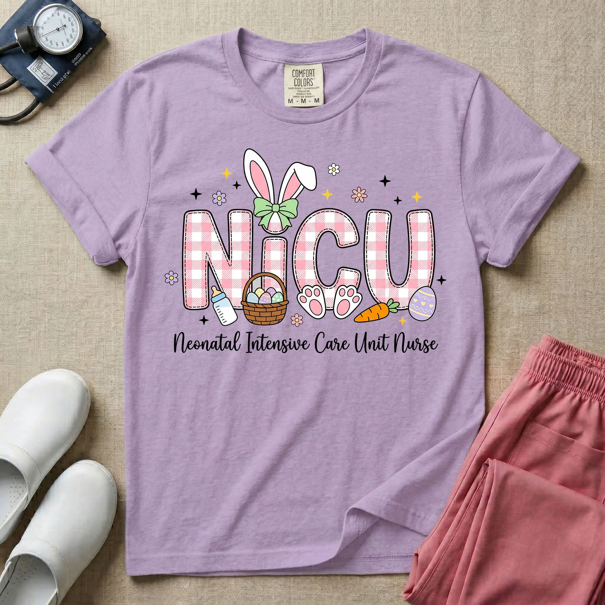 Neonatal Intensive Care Unit NICU nursing t-shirt featuring the letters NICU in a pink plaid pattern with bunny ears on the I, alongside a basket and Easter eggs, positioned above the cursive text "Neonatal Intensive Care Unit Nurse".