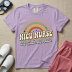 Neonatal Intensive Care Unit NICU nurse t-shirt with a retro vintage rainbow and tiny humans big attitude graphic in orchid color.