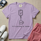 A funny minimalist ER nursing t-shirt featuring a white line drawing of an IV bag containing a coffee bean dripping into a mug labeled "night shift", sitting above the lower-case typewriter text "it's giving er nurse".