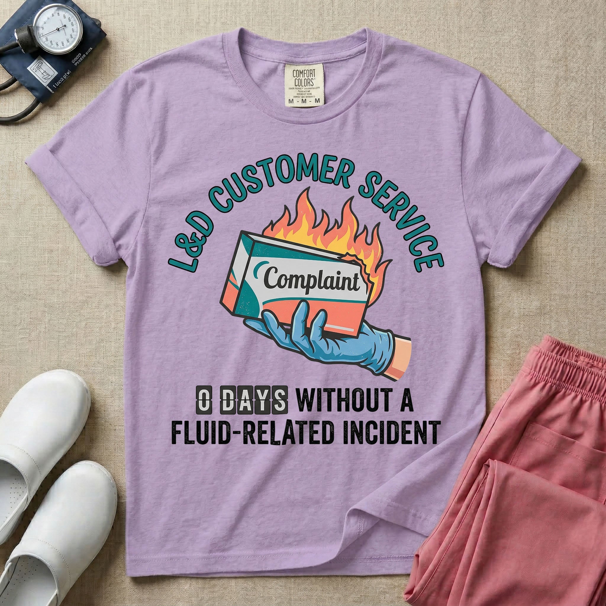 Labor and Delivery L&D nurse t-shirt with funny customer service burning complaint box and zero days without a fluid-related incident graphic in orchidcolor.
