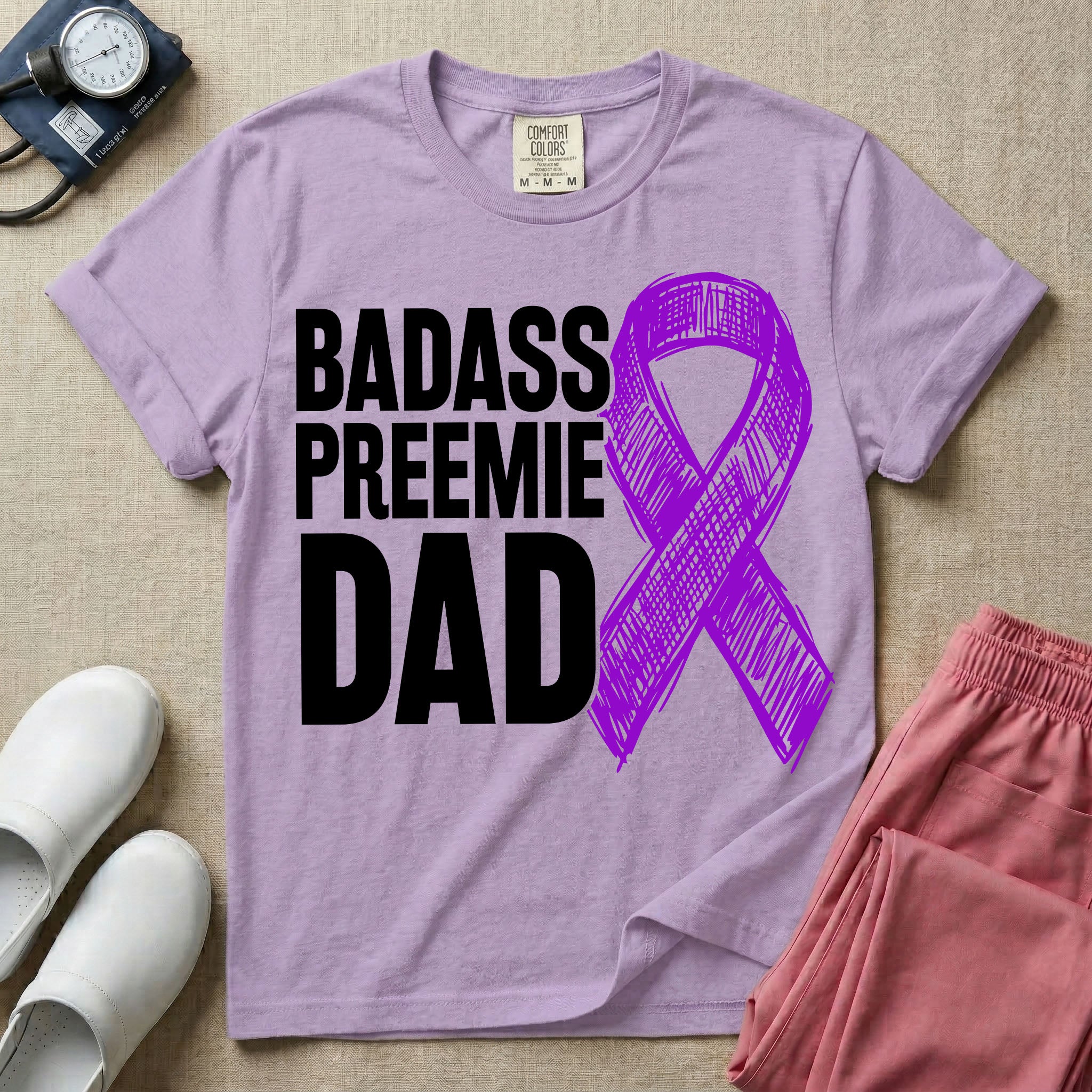 A graphic for the Neonatal Intensive Care Unit featuring the stacked, bold white text 'BADASS PREEMIE DAD' next to a large, textured purple awareness ribbon.