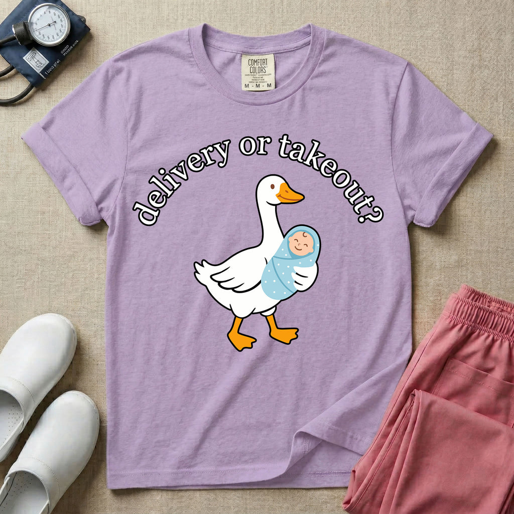 A funny L&D nursing t-shirt featuring a graphic of a white silly goose carrying a baby in a blue swaddle in its beak, surrounded by the humorous arched text "delivery or takeout?".