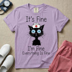 General nursing t-shirt featuring a humorous graphic of a frazzled black cat wearing a medical cross nurse cap alongside the text "It's Fine I'm Fine Everything Is Fine".