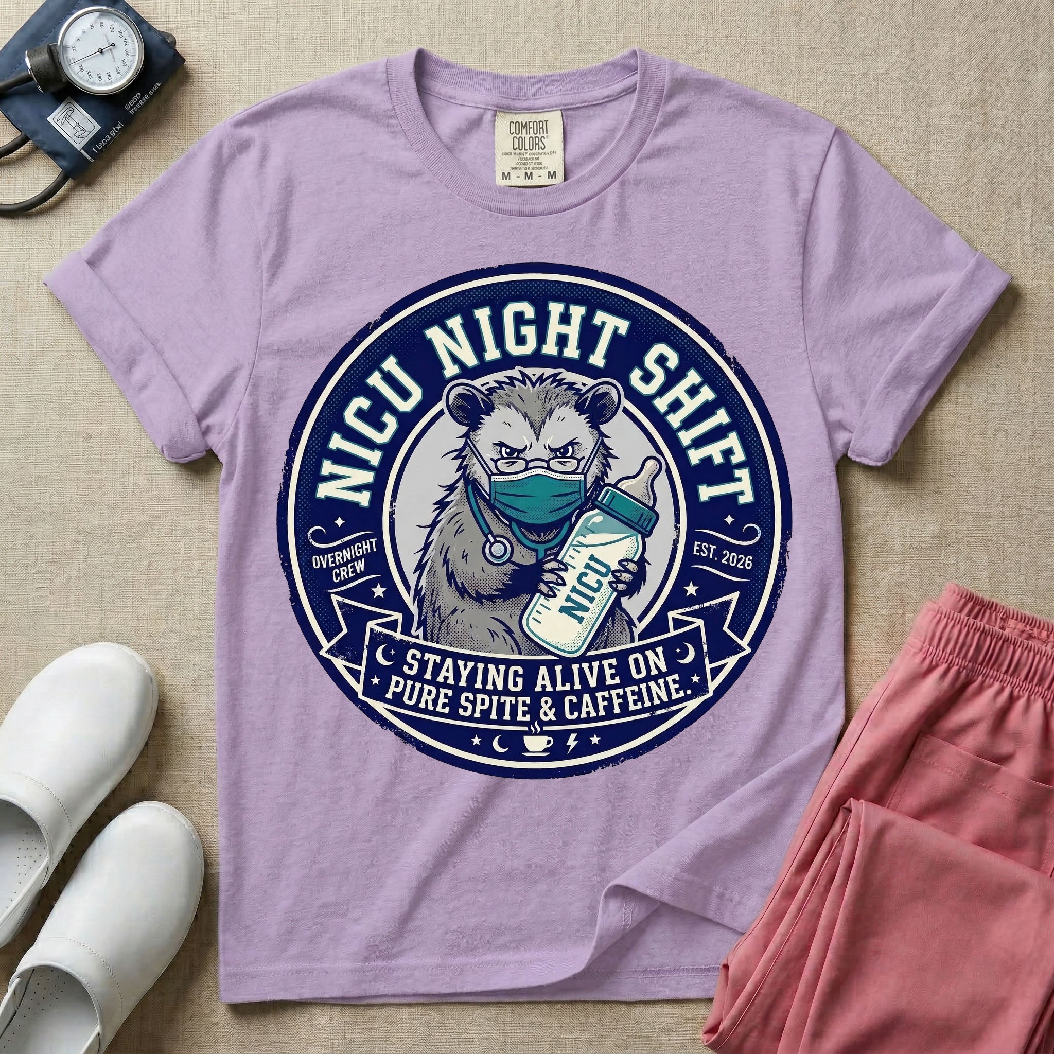 A humorous graphic for a Neonatal Intensive Care Unit featuring a circular design with an illustration of a tired raccoon wearing a medical face mask and holding a baby bottle labeled 'NICU', surrounded by the text 'NICU NIGHT SHIFT' at the top and 'STAYING ALIVE ON PURE SPITE & CAFFEINE' at the bottom.