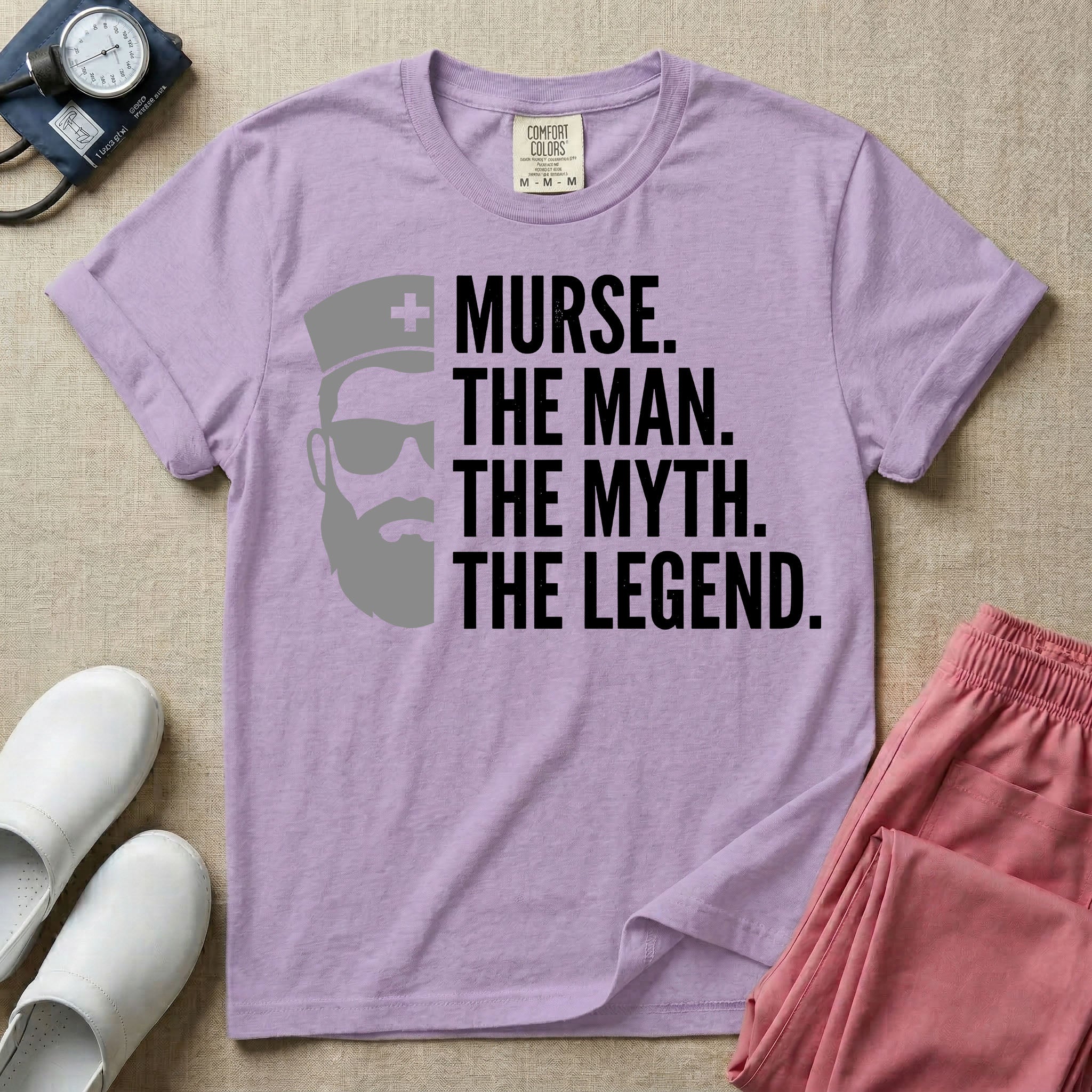 General nursing t-shirt featuring a minimalist white graphic of a bearded man wearing sunglasses and a nurse cap alongside the text "MURSE. THE MAN. THE MYTH. THE LEGEND."