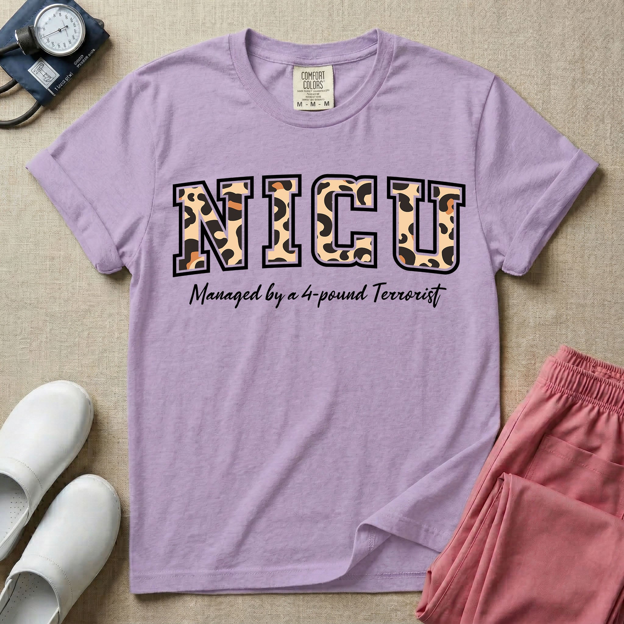 Neonatal Intensive Care Unit NICU nurse t-shirt with leopard print block letters and funny managed by a 4-pound terrorist graphic in orchid color.