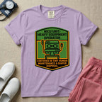 A graphic resembling a patch with green borders and orange inner sections featuring an illustration of a medical incubator in the center, with the text 'NICU UNIT: HEAVY EQUIPMENT OPERATOR' at the top and 'CERTIFIED IN TINY HUMAN MAINTENANCE & DIAPER DISPOSAL' at the bottom.