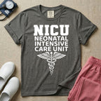 A t-shirt featuring the word NICU in large collegiate block letters above the spelled-out text Neonatal Intensive Care Unit and a medical caduceus symbol.
