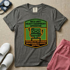 A graphic resembling a patch with green borders and orange inner sections featuring an illustration of a medical incubator in the center, with the text 'NICU UNIT: HEAVY EQUIPMENT OPERATOR' at the top and 'CERTIFIED IN TINY HUMAN MAINTENANCE & DIAPER DISPOSAL' at the bottom.