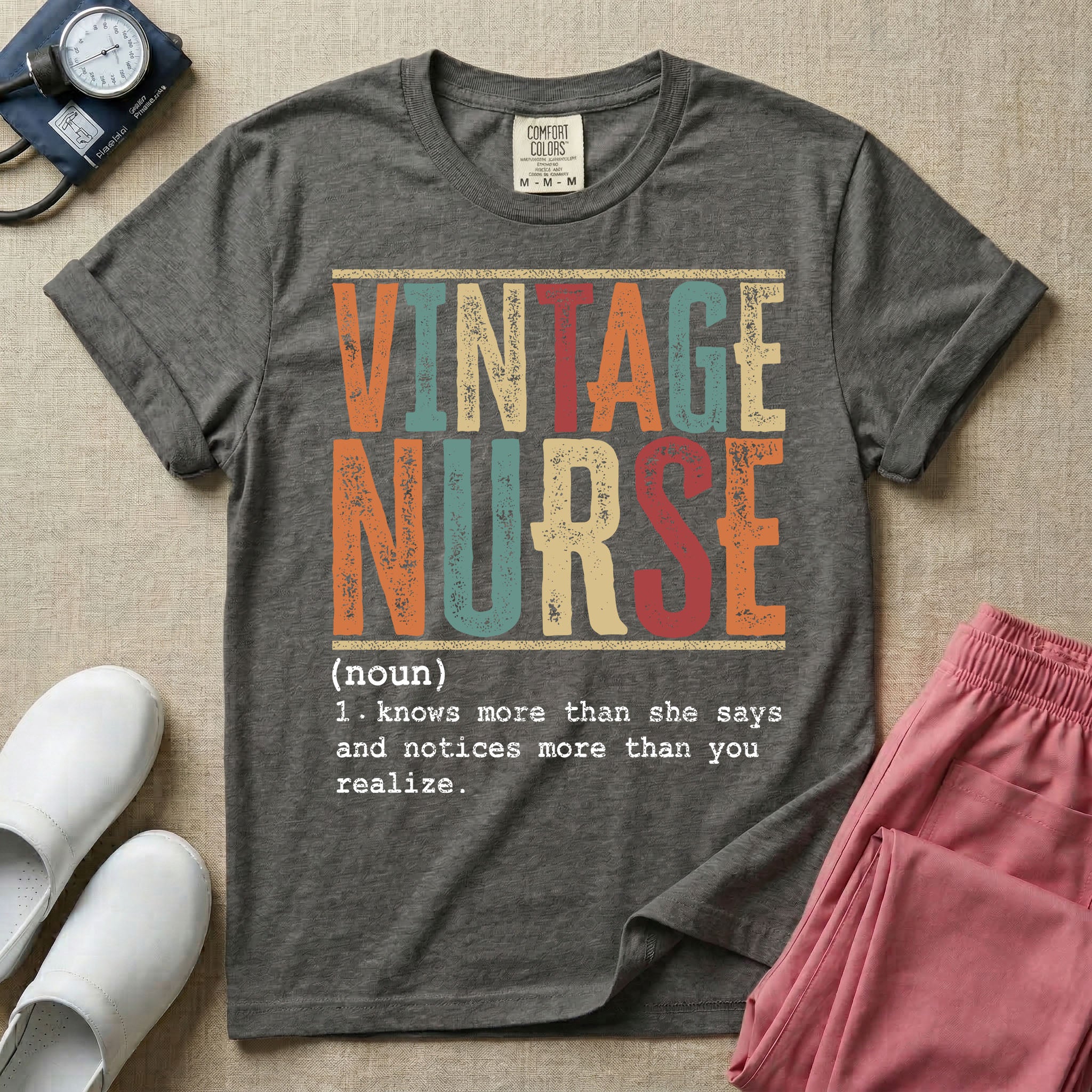 A humorous General Nursing graphic featuring large distressed retro-style block letters spelling VINTAGE NURSE, positioned above a dictionary-style definition in white typewriter font that reads (noun) 1. knows more than she says and notices more than you realize.