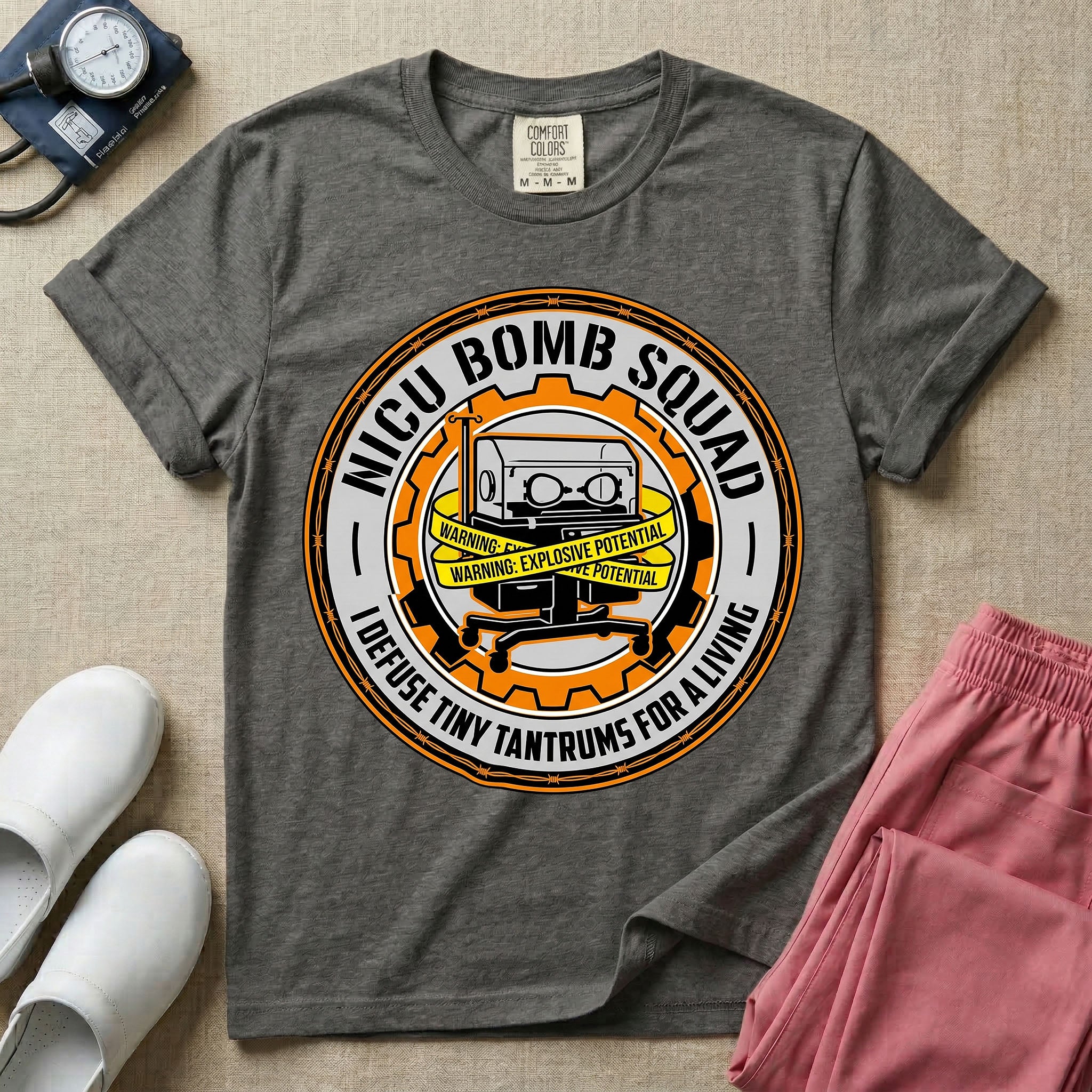 Neonatal Intensive Care Unit NICU nurse t-shirt with funny bomb squad defusing tiny tantrums graphic in pepper color.