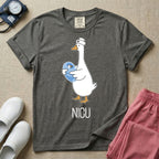 A t-shirt featuring an illustration of a white silly goose wearing a nurse's cap and holding a baby goose swaddled in a blue blanket, with the text NICU printed below.