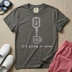 A funny minimalist ER nursing t-shirt featuring a white line drawing of an IV bag containing a coffee bean dripping into a mug labeled "night shift", sitting above the lower-case typewriter text "it's giving er nurse".
