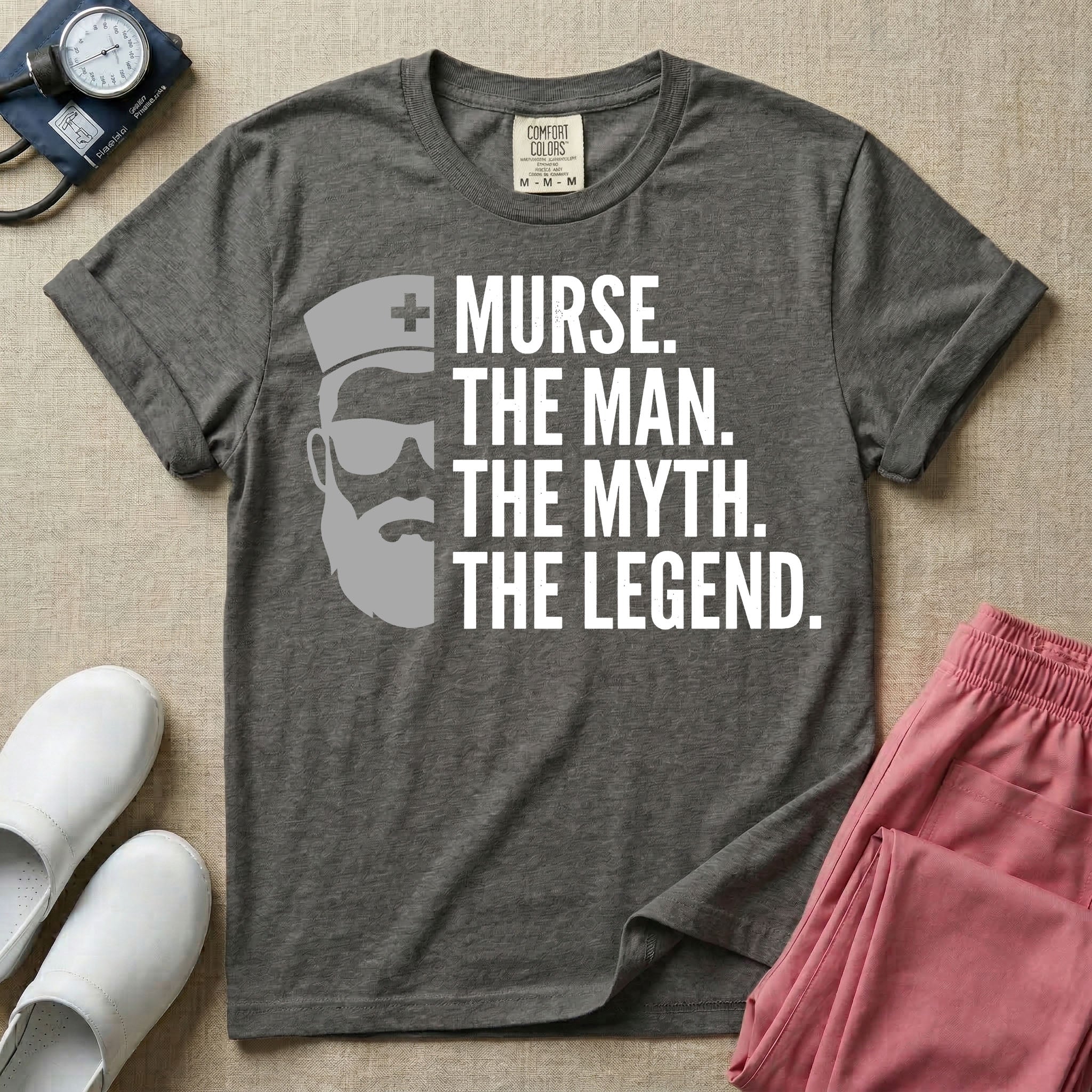 General nursing t-shirt featuring a minimalist white graphic of a bearded man wearing sunglasses and a nurse cap alongside the text "MURSE. THE MAN. THE MYTH. THE LEGEND."