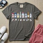 A humorous retro-style t-shirt for nurses featuring a row of seven different medical vials and medicine ampules lined up above the word "FRIENDS", which is styled with colored dots between the letters to resemble the classic television show logo.