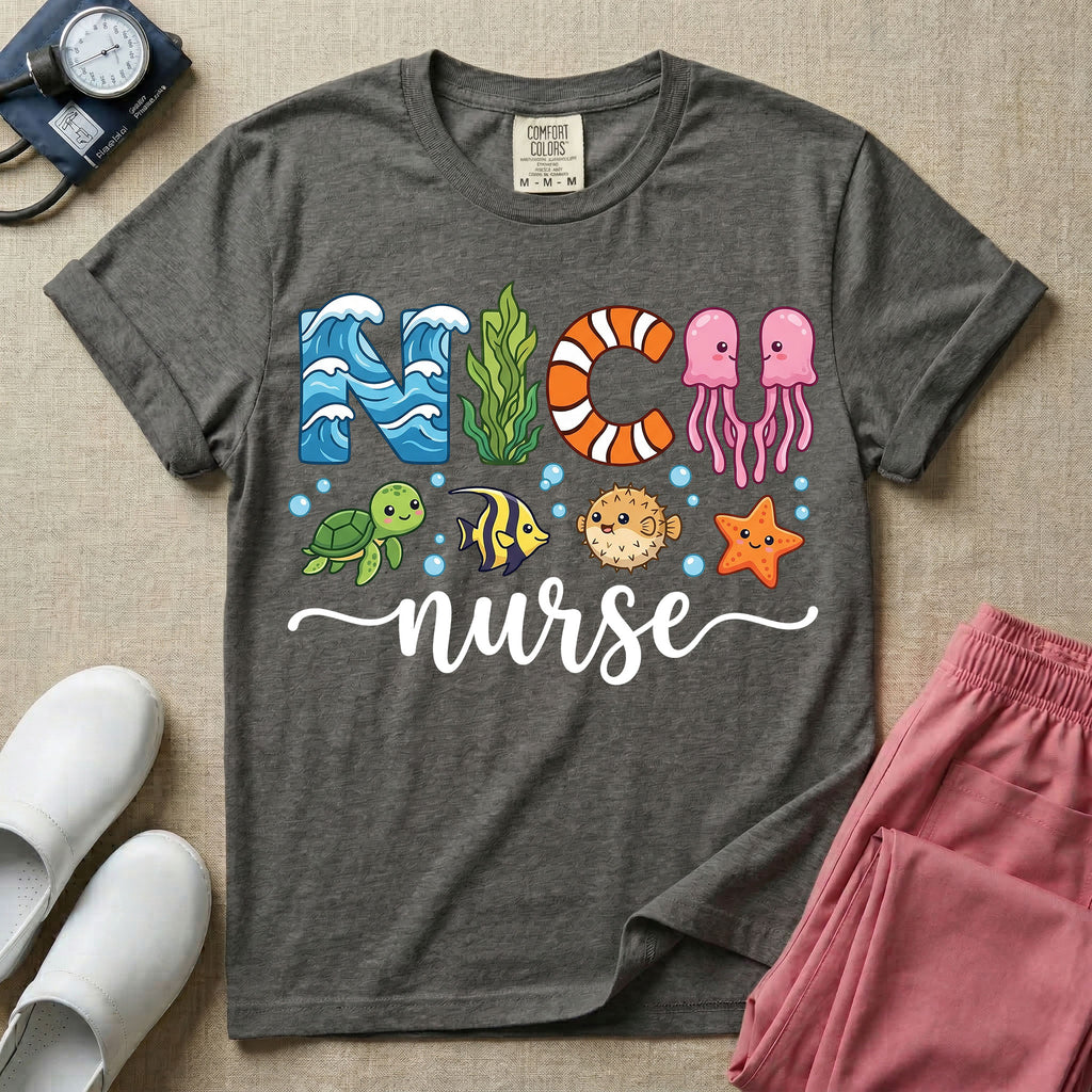 A cute t-shirt for NICU nurses featuring the text "NICU nurse" where the letters are designed with ocean elements like waves, seaweed, and a jellyfish, surrounded by under the sea creatures including a sea turtle, tropical fish, pufferfish, and starfish.