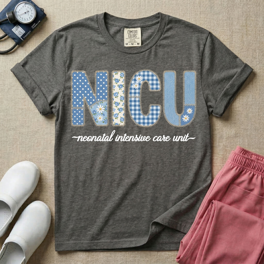 A t-shirt for NICU nurses featuring the large text "NICU" designed to look like faux embroidery with floral and plaid patterns, and the words "neonatal intensive care unit" written in a delicate script font underneath.