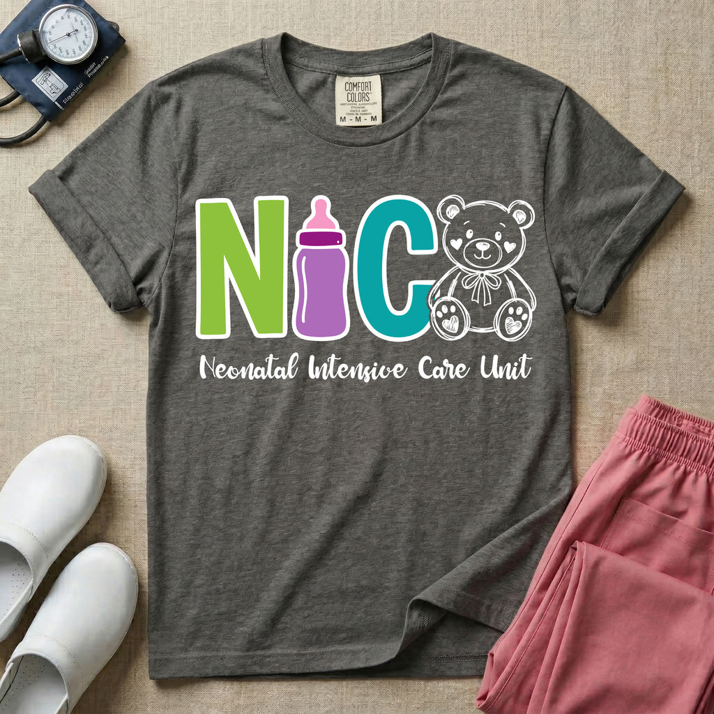 A t-shirt featuring the acronym NICU creatively spelled out using a green letter N, a purple baby bottle, a teal letter C, and a white outlined teddy bear, with the words Neonatal Intensive Care Unit written in cursive script below.