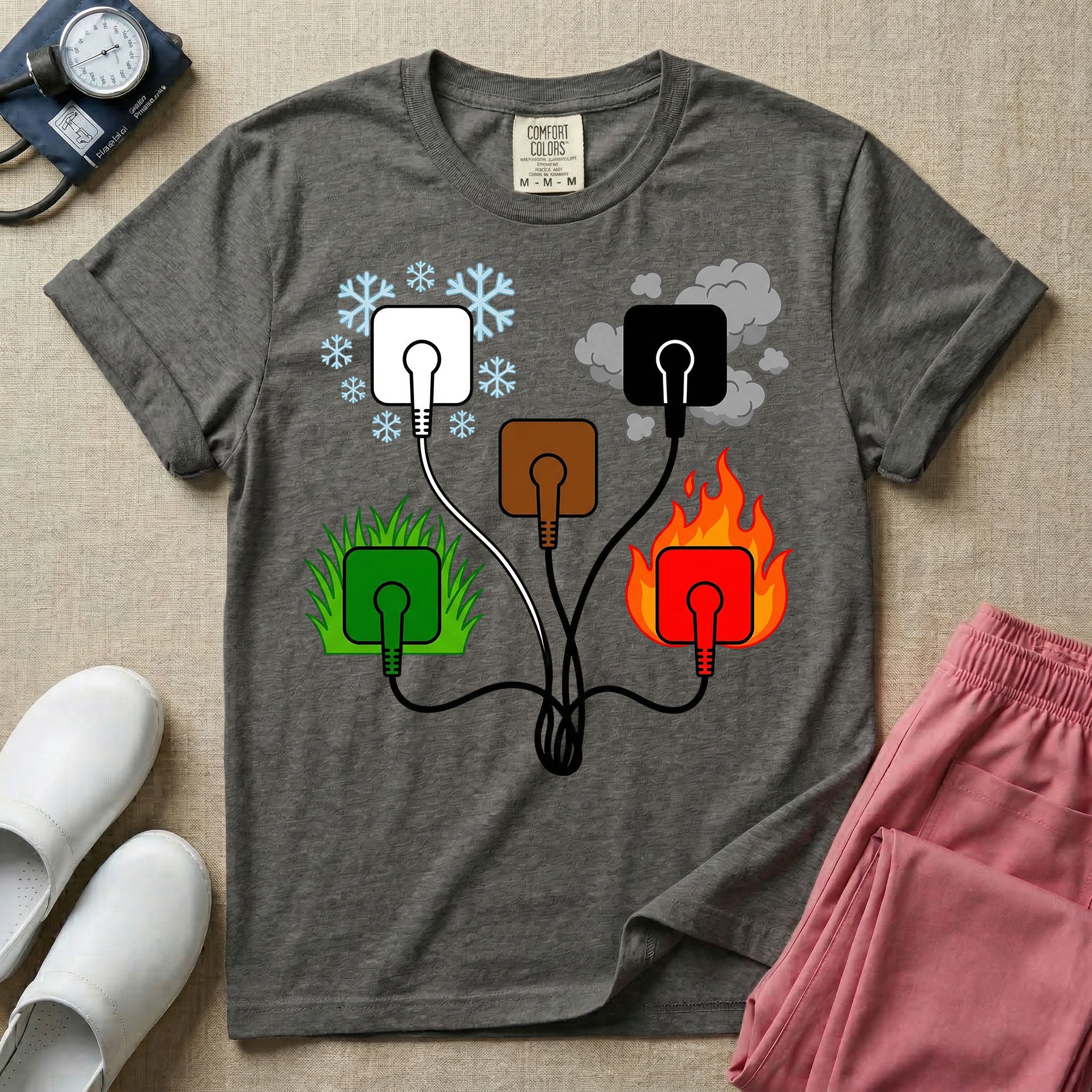 A minimalist t-shirt for nurses featuring an ECG lead placement mnemonic graphic with five connected electrical plugs, illustrating white snow over green grass, black smoke over red fire, and a central brown plug.