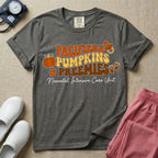 A t-shirt featuring the stacked text PACIFIERS PUMPKINS & PREEMIES in wavy orange, yellow, and brown retro lettering decorated with a pumpkin, pacifier, and baby footprints, with Neonatal Intensive Care Unit written in cursive below.