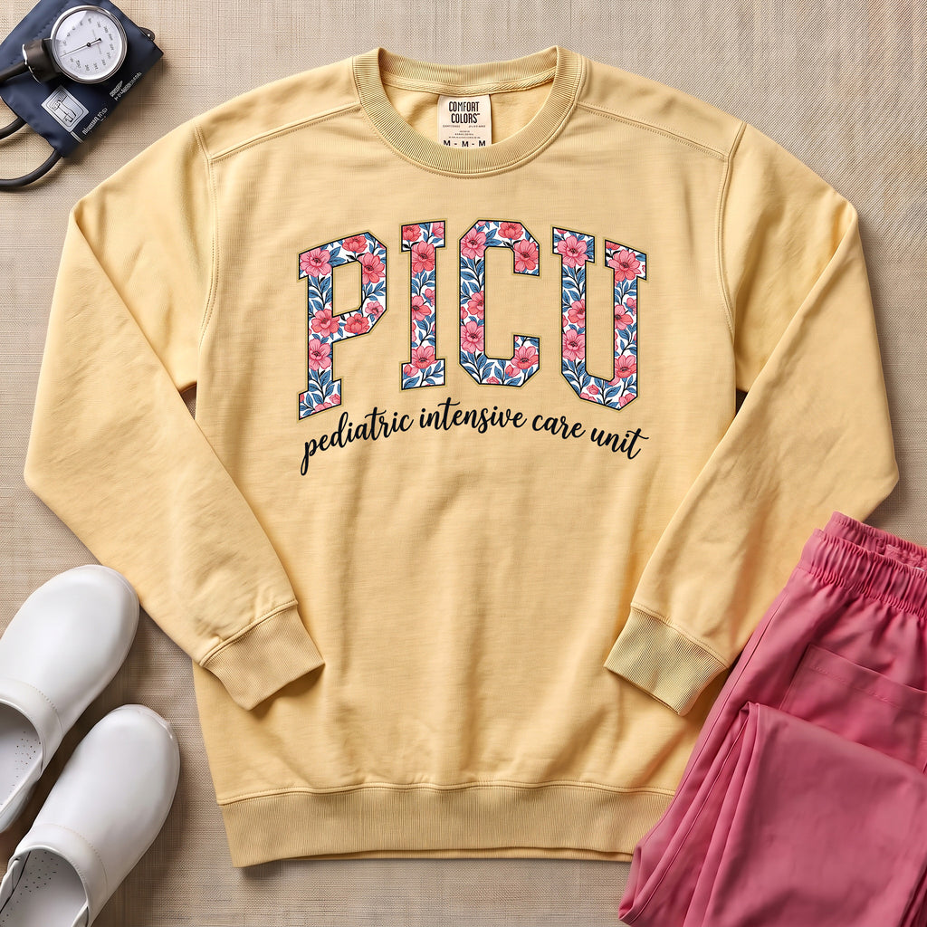 Floral PICU Pediatric Intensive Care Unit Nurse Sweatshirt - Butter Comfort Colors Sweatshirt | HugTee