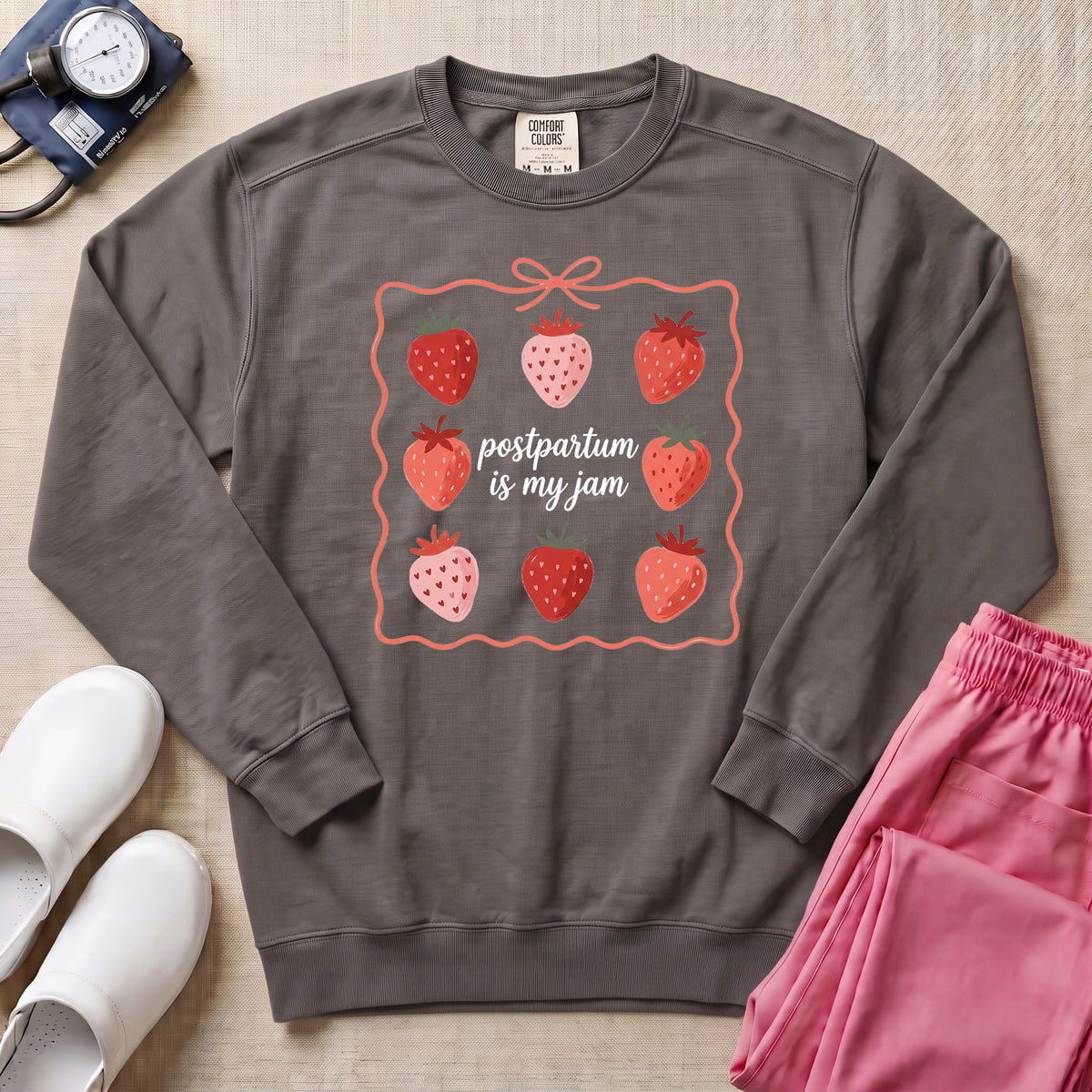 Postpartum Is My Jam Strawberry Coquette Nurse Sweatshirt - Pepper Lifestyle Hero Mockup | HugTee