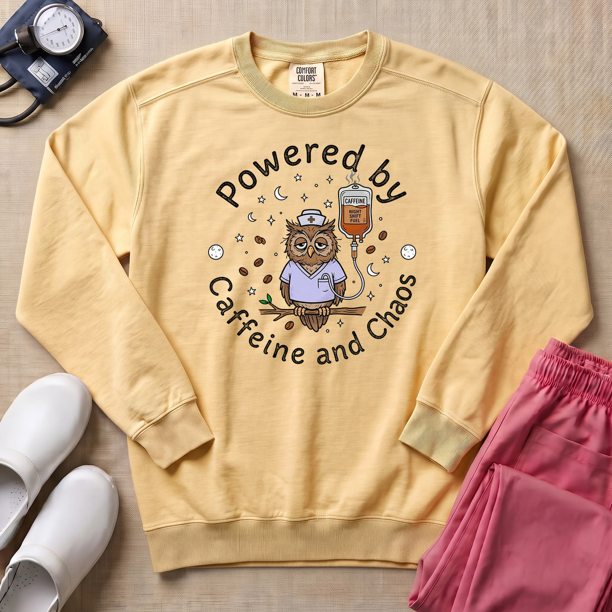Powered By Caffeine And Chaos Night Shift Nurse Sweatshirt - Butter Comfort Colors Sweatshirt | HugTee