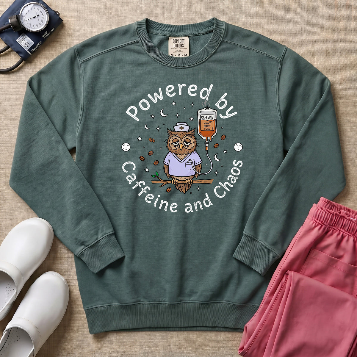 Powered By Caffeine And Chaos Night Shift Nurse Sweatshirt - Blue Spruce Comfort Colors Sweatshirt | HugTee