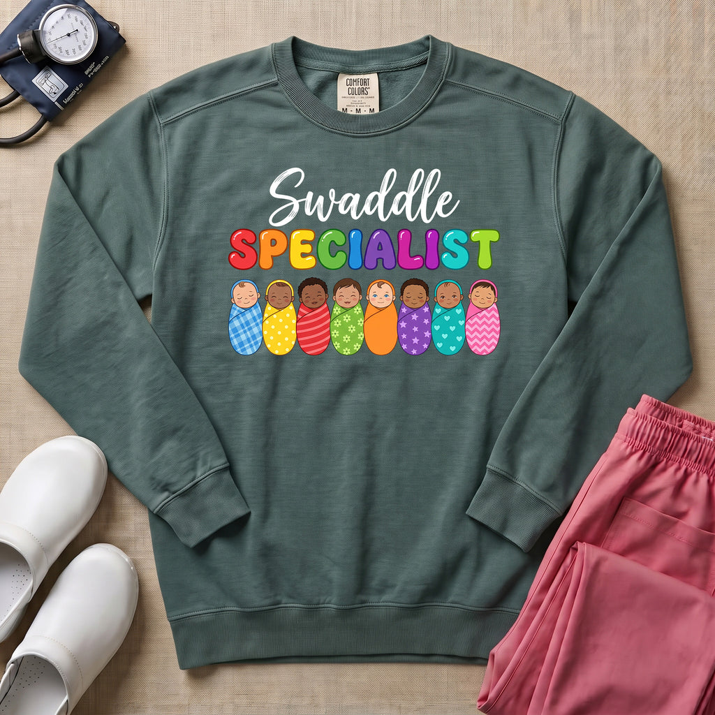 Swaddle Specialist L&D and NICU Nurse Sweatshirt - Blue Spruce Comfort Colors Sweatshirt | HugTee