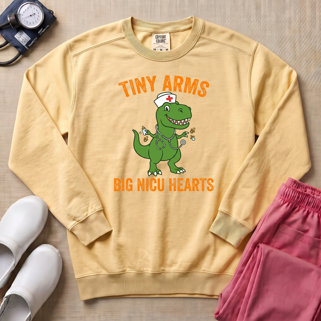 Tiny Arms Big NICU Hearts Funny T-Rex Nurse Sweatshirt - Butter Comfort Colors Sweatshirt | HugTee