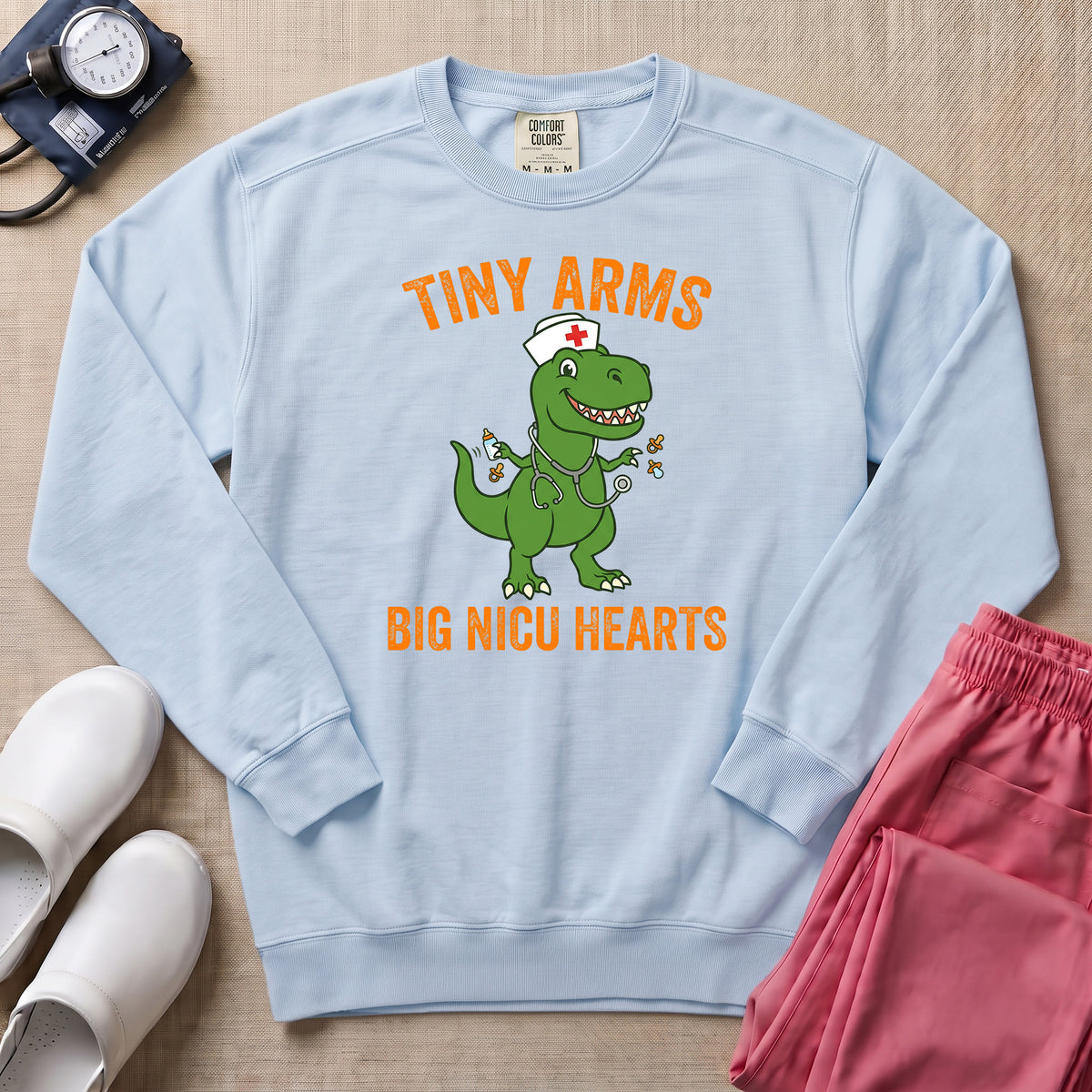 Tiny Arms Big NICU Hearts Funny T-Rex Nurse Sweatshirt - Chambray Comfort Colors Sweatshirt | HugTee